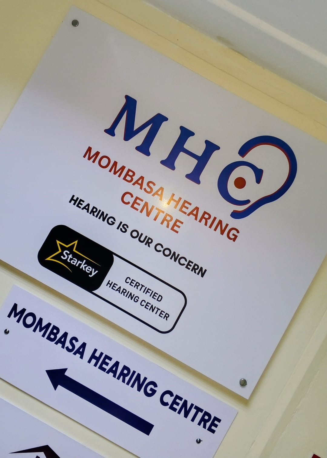 Mombasa Hearing Centre signage and directional arrow outside the entrance
